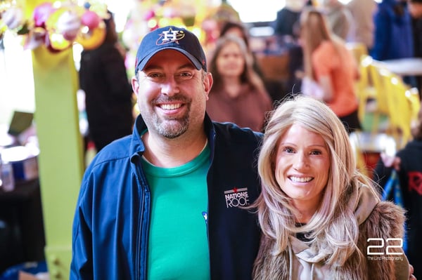 Two volunteers smiling together at a past HTX Basket Brigade event
